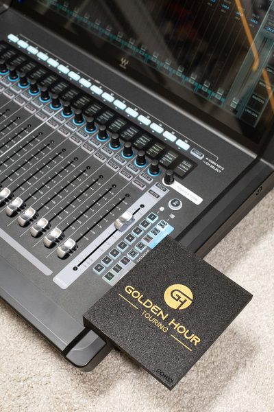 Custom Golden Hour Touring branded mouse pad mounted on the LV1 console